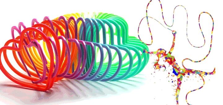 Rainbow slinky toy with a colorful ribbon dancer figurine.
