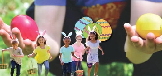 Children wearing bunny ears run with baskets to collect Easter eggs.