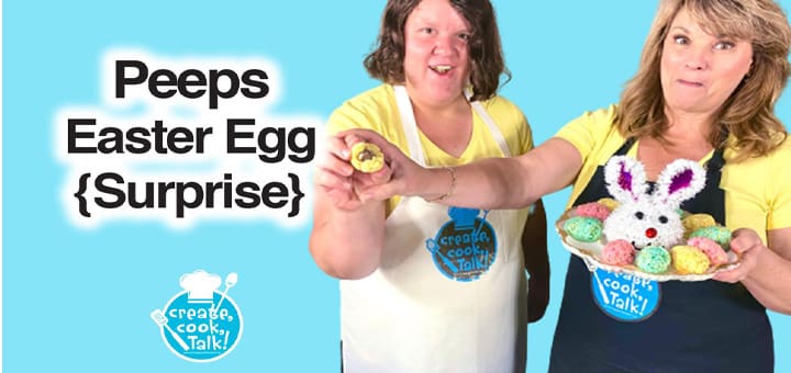 Two women hold Easter eggs and a Peeps bunny cake.