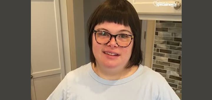 Abigail Krevsky wearing glasses and a light blue shirt.