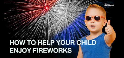 Boy in sunglasses gives a thumbs up with fireworks in the background.