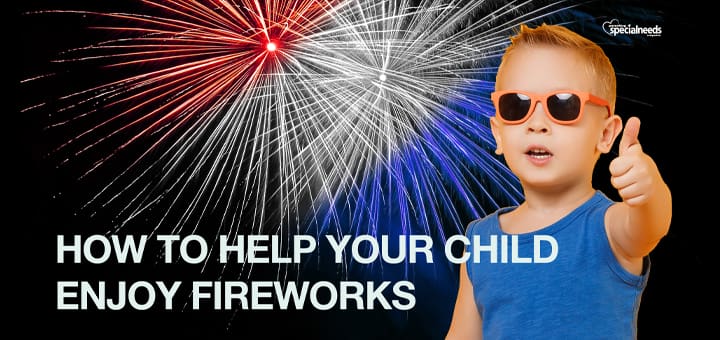 Boy in sunglasses gives a thumbs up with fireworks in the background.