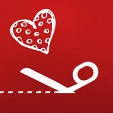 A white heart with polka dots floats above white scissors cutting a dotted line on a red background.