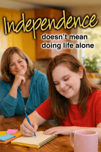 A woman smiles as a girl writes in a notebook at a table.